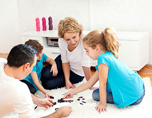 fmaily playing dominos